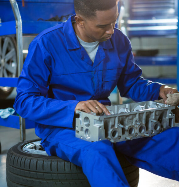 Mechanic repairing a car parts in repair garage